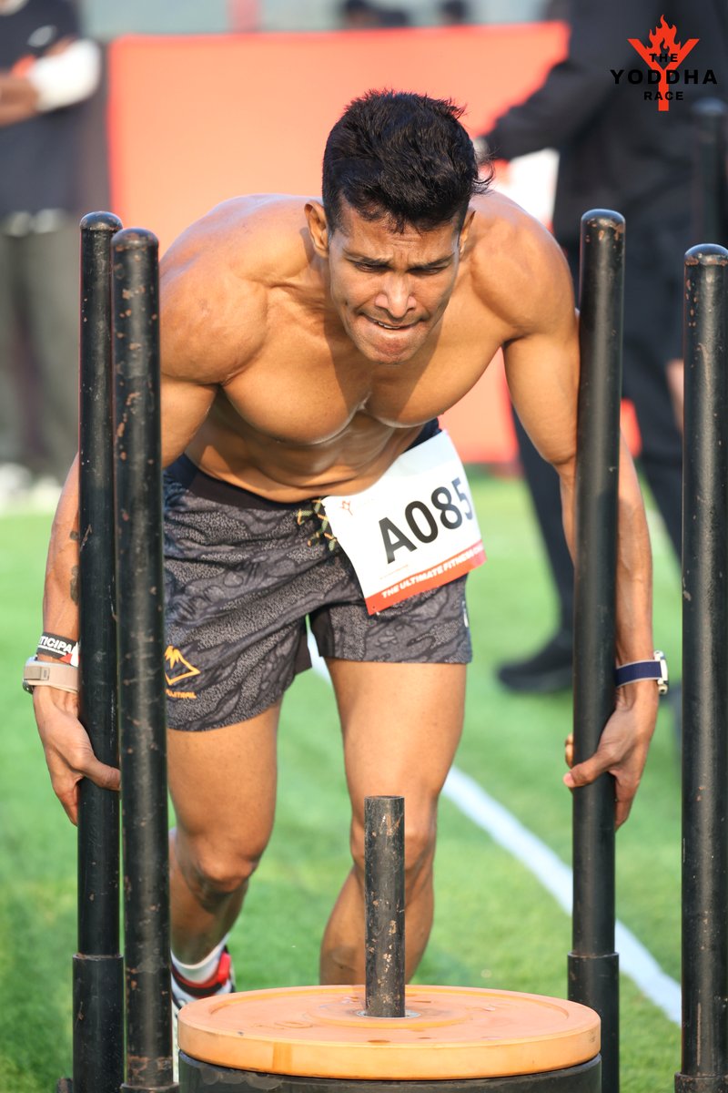 Coach Joby pushing a sled at the Yoddha Race